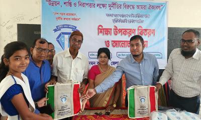 গোপালগঞ্জে দুর্নীতি বিরোধী স্লোগান সম্বলিত শিক্ষা উপকরন বিতরন