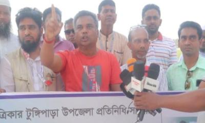 টুঙ্গিপাড়ায় সাংবাদিকের উপর হামলার প্রতিবাদে মানববন্ধন